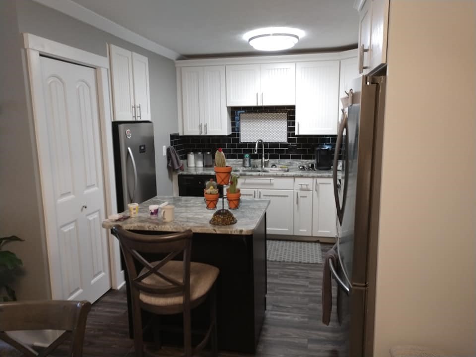 black subway tile, behind the sink, framed accent tile, penny tile, backsplash, black and white, round tile, circle tile, mosaic tile, accent tile