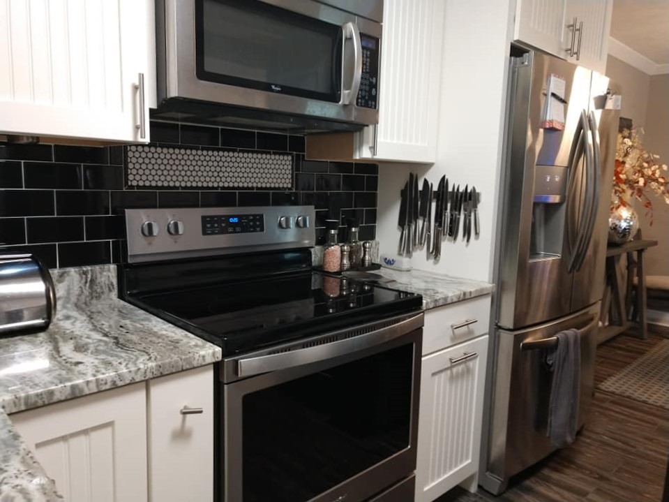 black subway tile, behind the sink, framed accent tile, penny tile, backsplash, black and white, round tile, circle tile, mosaic tile, accent tile